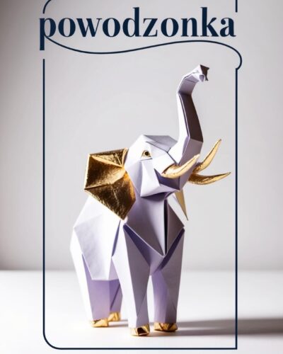 Origami słoń z białego papieru ze złotymi akcentami z uniesionym trąbem i napis „powodzonka”